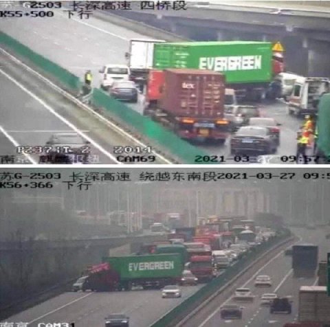A truck carrying an Evergreen container blocks traffic in China in the same diagonal position as the ship in the Suez canal