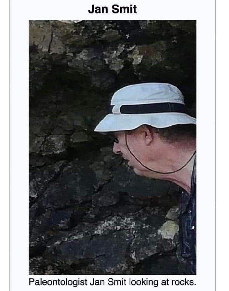 Jan Smit я Paleontologist Jan Smit looking at rocks