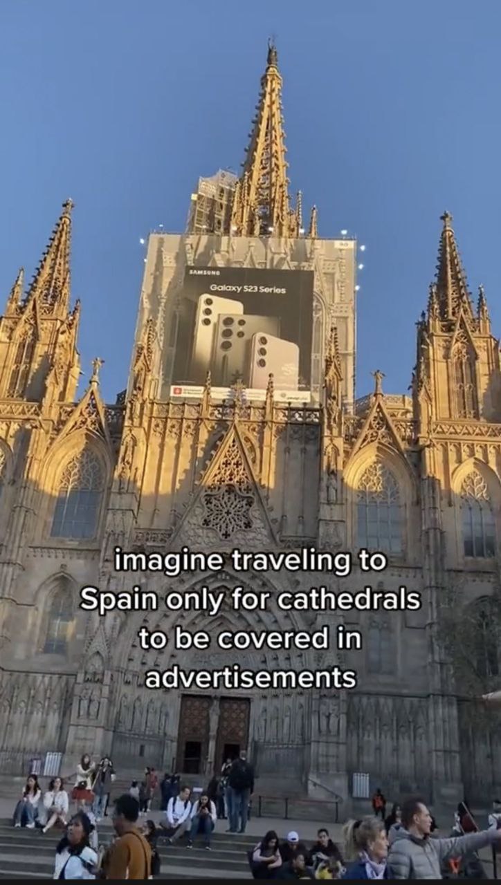 imagine traveling to Spain only for cathedrals to be covered in advertisements