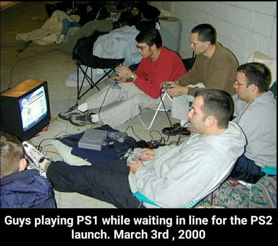 2 Guys playing while waiting line for the launch. March 2000