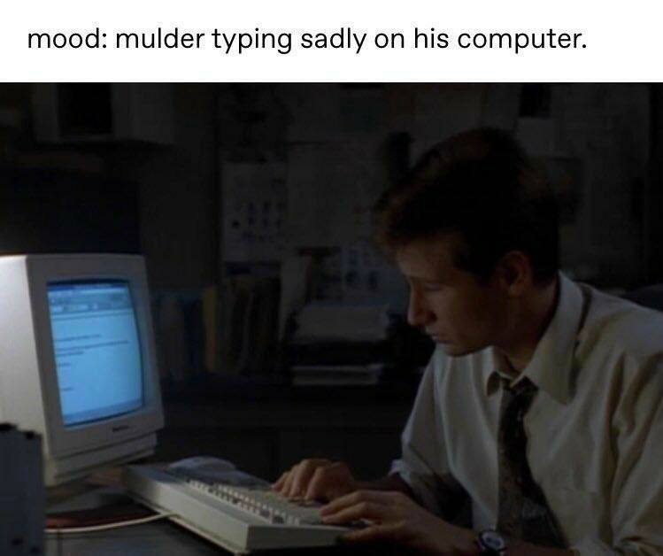 mood: mulder typing sadly on his computer.