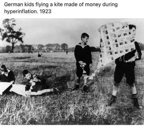 German kids flying a kite made of money during hyperinflation. 1923 к Я