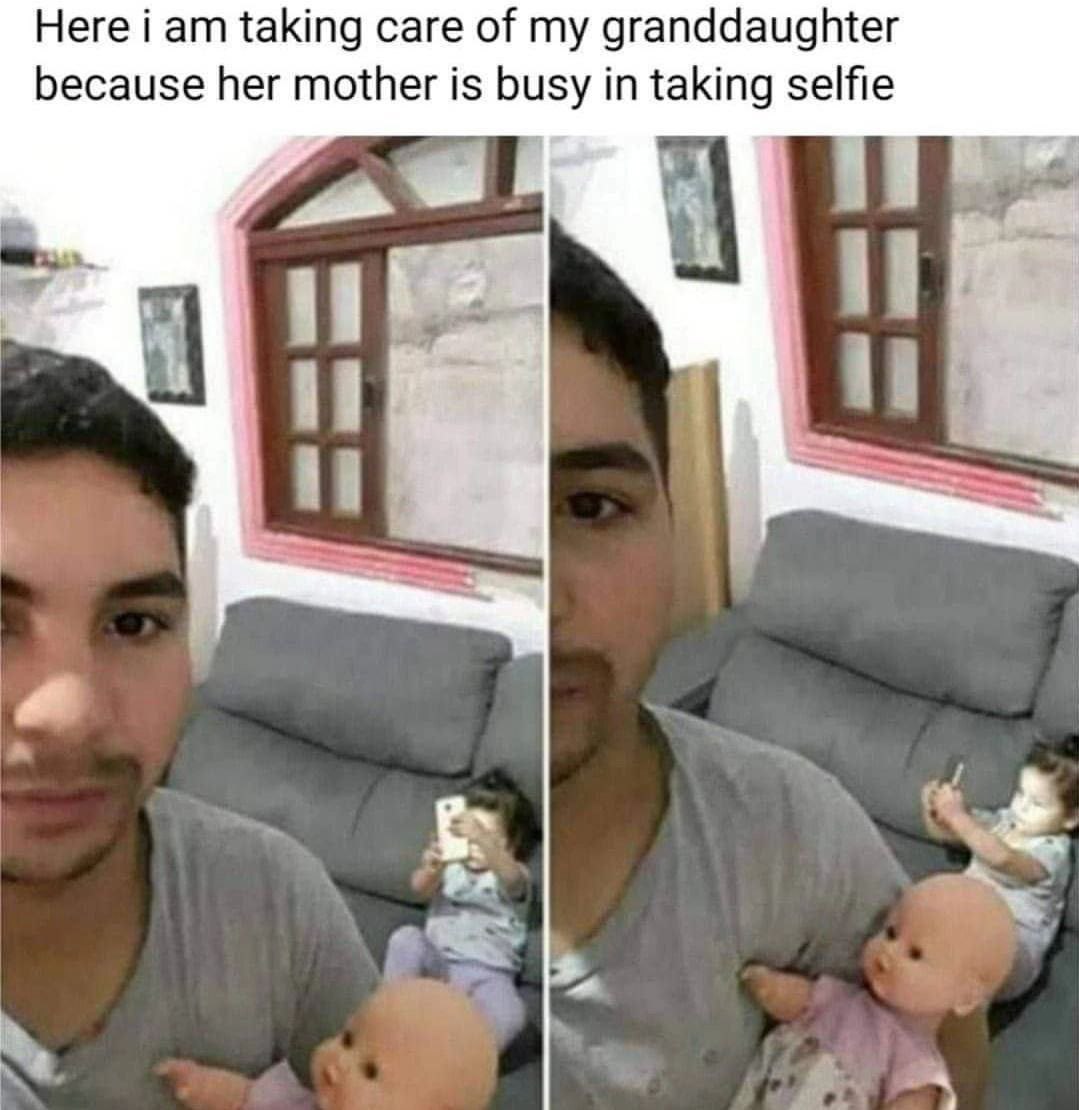 Here i taking care of my granddaughter because her mother is busy in taking selfie be