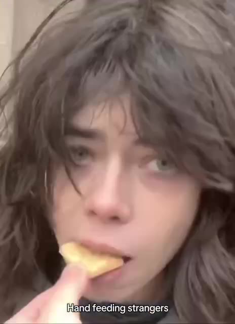 В апа feeding strangers,