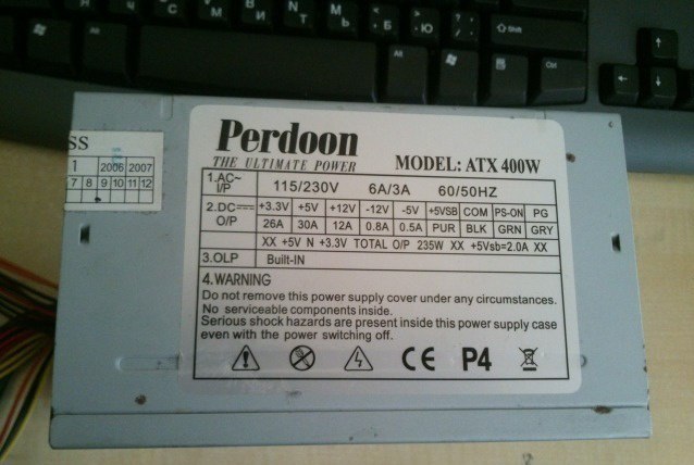 и Perdoon THE POWER MODEL: ATX бА/ЗА 60/S0HZ у [26А 12А |0 ЗА BLK [GRN GRY TOTAL 3.OLP 4. WARNING not remove this power supply cover under any circumstances No serviceable components inside Serious sh