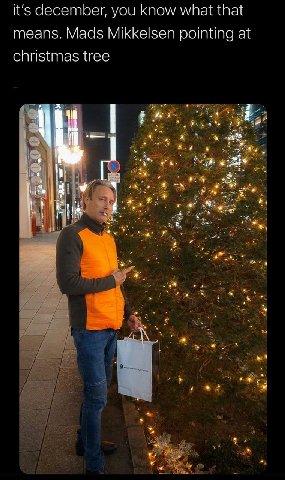 it's december, you know what that means. Mads Mikkelsen pointing at christmas tree 7