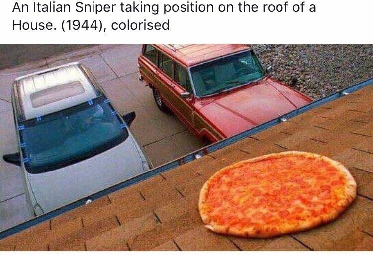 An Italian Sniper taking position on the roof of a House. (1944), colorised