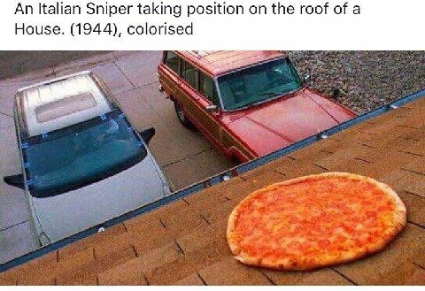 An Italian Sniper taking position on the roof of a House. (1944), colorised