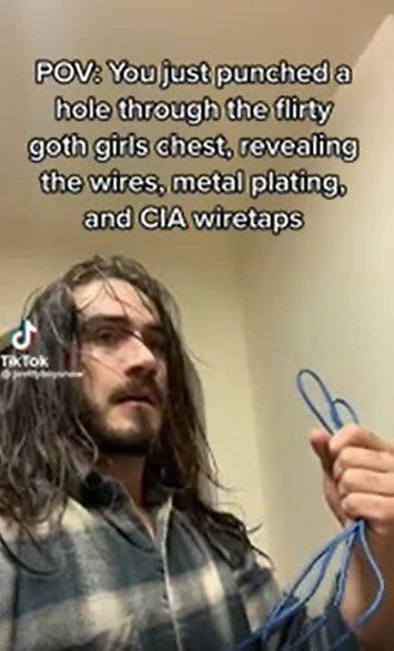 POV: Youljustipunchedat hole flirty goth girls chest, revealing the wires, metal plating. and CIA wiretaps
