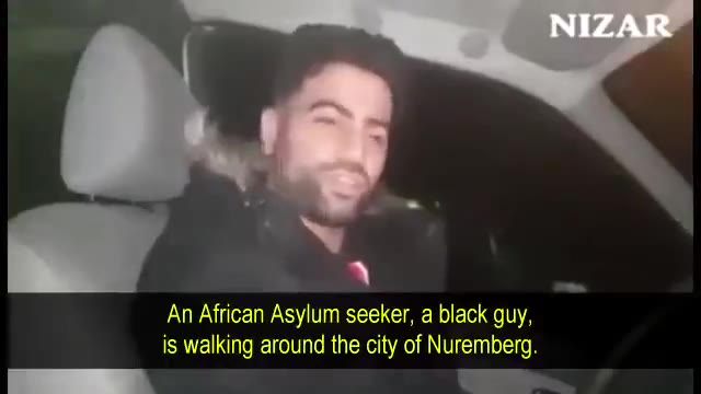 An African Asylum seeker, a black guy, is walking around the city of Nuremberg. and everything else ." The person says, | may live in Germany, thank-you for that you took me in as refugee". The person