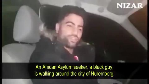 An African Asylum seeker, a black guy, is walking around the city of Nuremberg. and everything else ." The person says, | may live in Germany, thank-you for that you took me in as refugee". The person