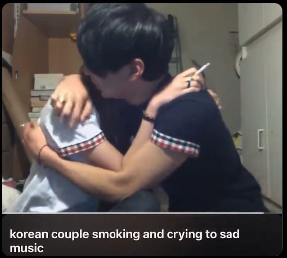 korean couple smoking and crying to sad music