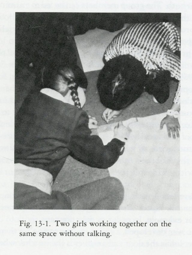 4 Fig. 13-1. Two girls working together on the same space without talking.
