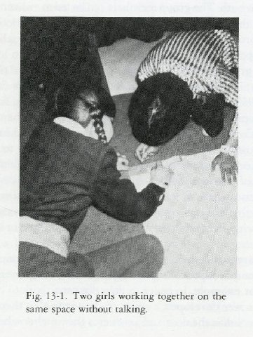 4 Fig. 13-1. Two girls working together on the same space without talking.