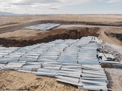 Here we can see old worn out windmill blades being planted to grow a crop of fresh blades - renewable energy is a miracle
