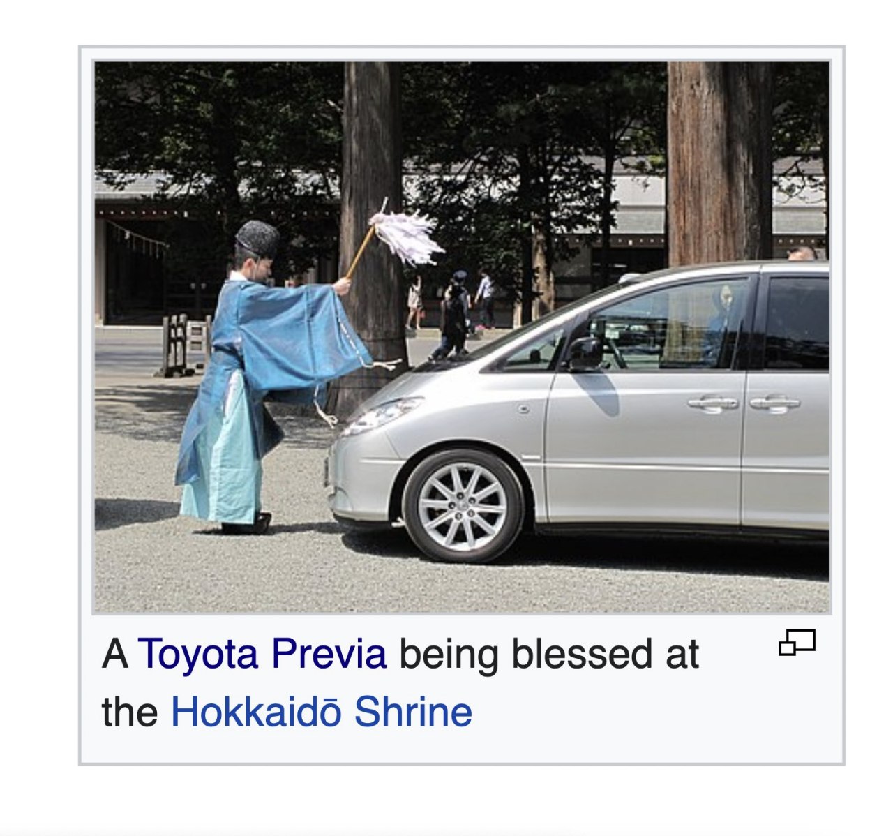 А А Toyota Previa being blessed at the Shrine