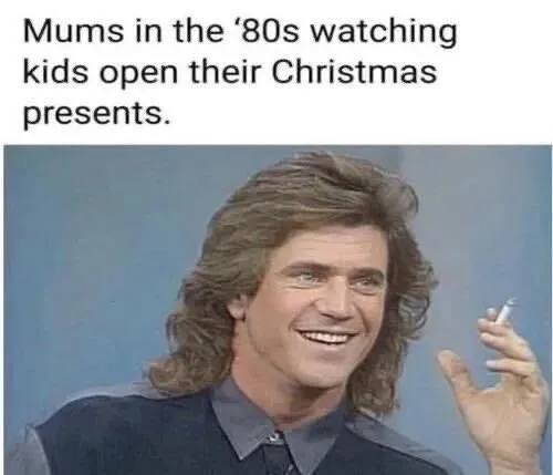 Mums the watching kids open their Christmas presents.