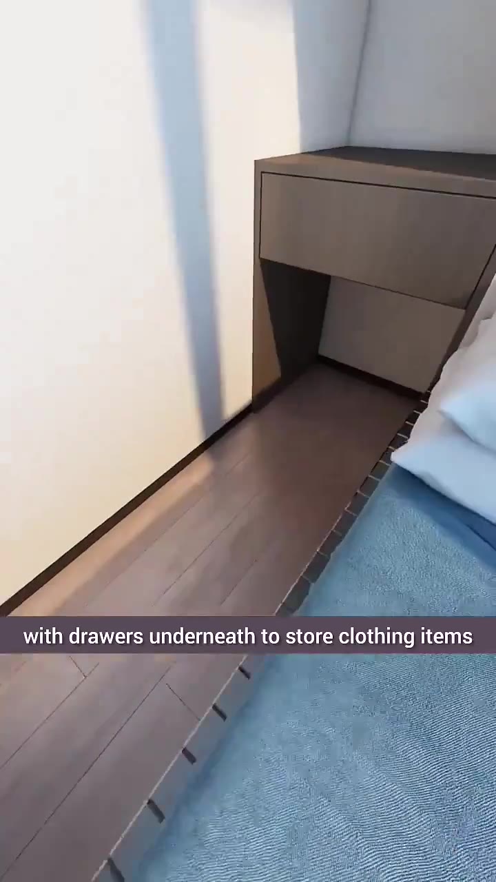 with drawers underneath to store clothing items Additionally, a projection screen is mounted with dimensions barely larger than a coffin
