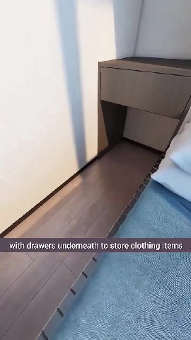 with drawers underneath to store clothing items Additionally, a projection screen is mounted with dimensions barely larger than a coffin