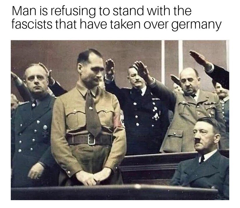 Man is refusing to stand with the fascists that have taken over germany 2 ANS a